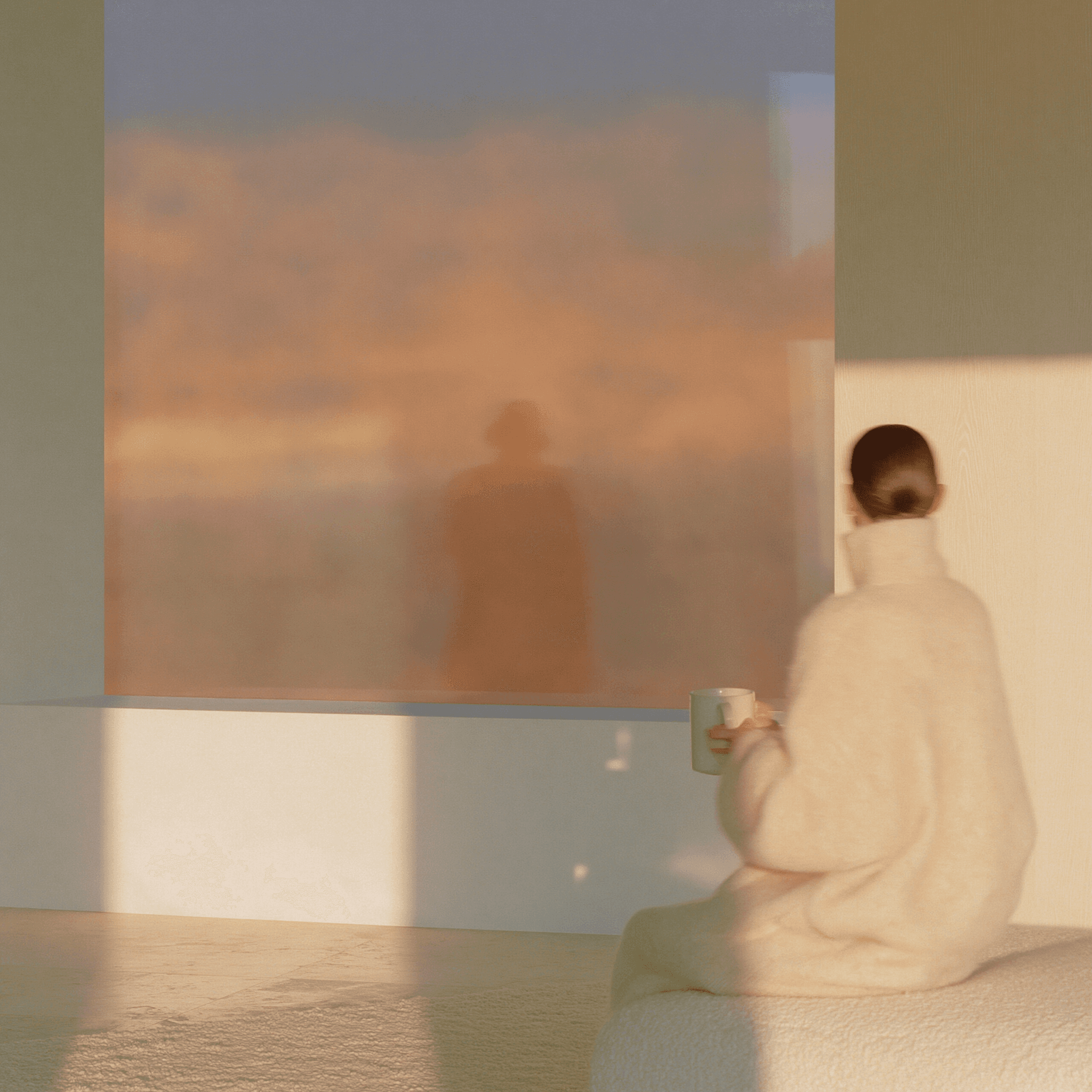 A woman in oversized cream cashmere at a tall window, evoking the calm composure that follows resolved gut symptoms